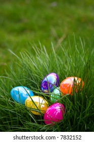 Plastic Colorful Easter Eggs In Grass