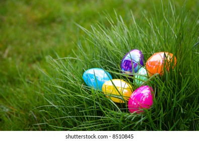 Plastic Colorful Easter Eggs In Grass