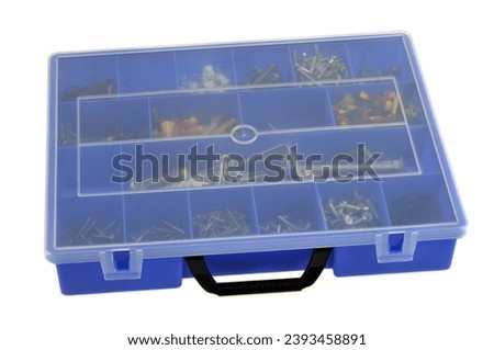 Plastic compartmentalized case for storing small DIY accessories close-up on white background Stock photo © 