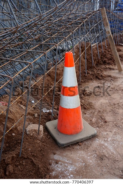 Plastic cone on\
the ground at street site\
work\
