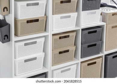 Plastic container boxes on a shelf on a rack for organizing home space and storing things, order and interior, selling household goods. Industrial background. - Powered by Shutterstock
