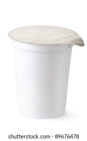 Plastic container for dairy foods with foil lid. Isolated on a white.
