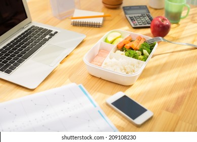 Plastic Container With Healthy Food On The Office Table