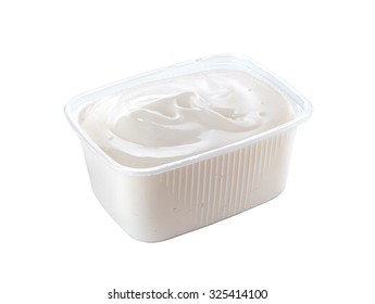 Plastic Container With Sour Cream Isolated On White Background
