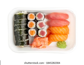 Plastic container with sushi set ready for takeout delivery. Take away lunch box with susi rolls, nori maki and nigiri sushi isolated top view - Powered by Shutterstock