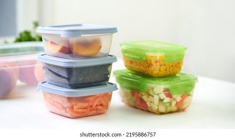 Plastic Containers With Raw Cut Vegetables For Freezing On Kitchen Table. Storage For Winter Storage In Trays