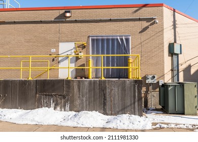 A Plastic Covering On A Loading Dock Door On A Building In Pittsburgh, Pennsylvania, USA On A Sunny Winter Day