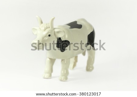 Plastic cow on a white background