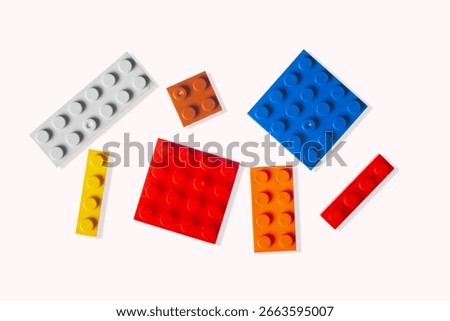Plastic cubes of children's construction set isolated on white background.