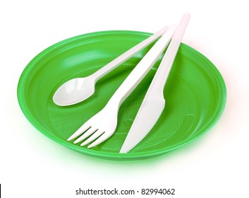 Plastic Cutlery On Green Plate Isolated On White