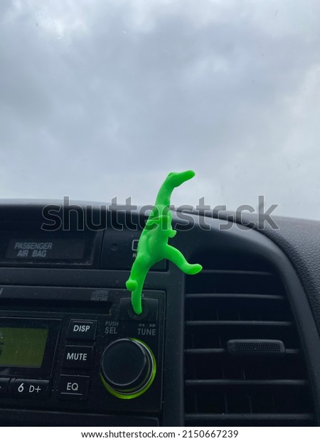 Plastic dinosaur in car’s aux\
input