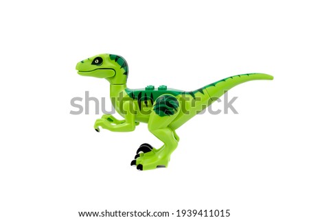 Plastic dinosaur toy isolated on white background.