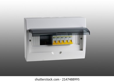 Plastic distribution board. Electrical board. Close-up. Isolated on gray background.