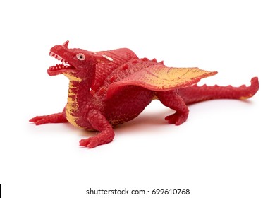 plastic dragon toy isolated on white background.
