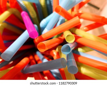 Plastic drinking straws full frame chaotic background ban on plastic