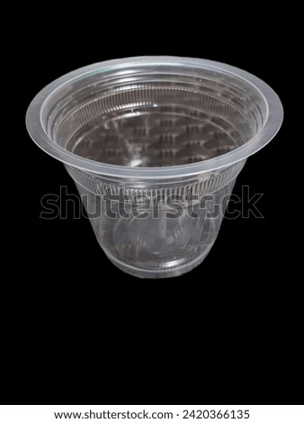 Plastic drinking water cup with black background