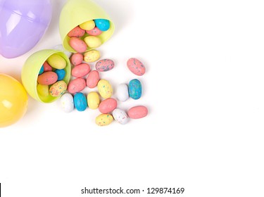 Plastic Easter Eggs  Filled With Candy In A Easter Basket On A White Background