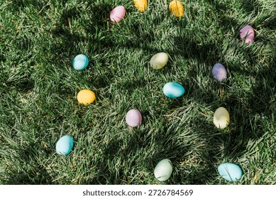 Plastic Easter eggs laying in the green grass.
