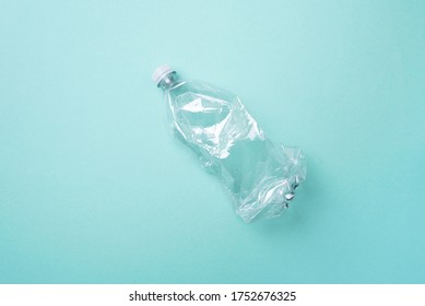 Plastic empty rumpled bottles on a blue background. Top view, copy space. Zero waste. Pollution, environmental protection concept. Reuse garbage, recycle, plastic free. Earth, world water day.