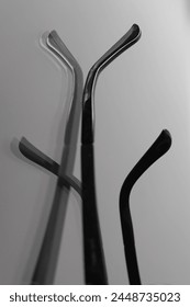 plastic fiddlesticks in shadow and reflections