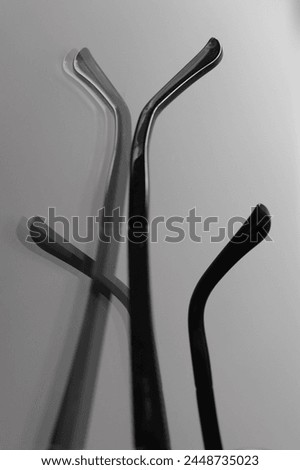 plastic fiddlesticks in shadow and reflections