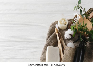 plastic free items. eco natural bamboo toothbrush, crystal deodorant,luffa, coconut soap,brushes,ear sticks, cotton. sustainable lifestyle concept. zero waste home, green