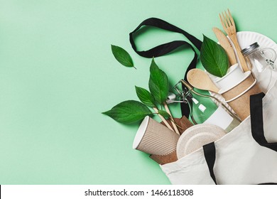 Plastic free set with cotton bag, glass jar, green leaves and recycled tableware top view. Zero waste, eco friendly concept. Flat lay. - Shutterstock ID 1466118308