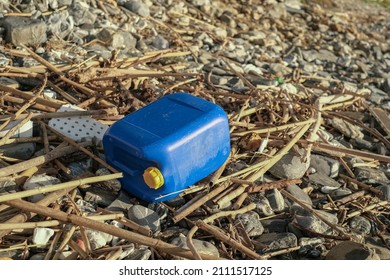 Plastic Fuel Tank Discarded On Contaminated Sea Coast Ecosystem, Environmental Waste Pollution 