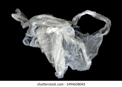 Plastic garbage bags placed on a dark background. From the study, it is found that the use and throw away are environmental problems.