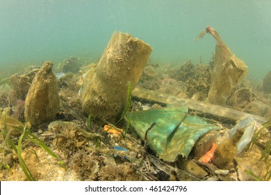 Plastic Garbage Pollution Underwater On Ocean Floor