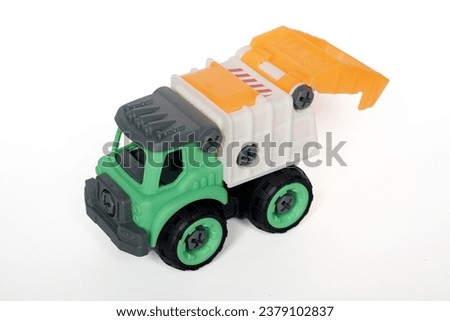 plastic garbage truck toy isolated on white background, DIY assemble toy for increasing kid's creativity.