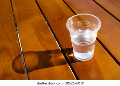 plastic glass with water on the table