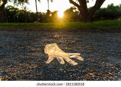 Plastic Gloves From A Supermarket Abandoned On The Ground In A Park, Polluting.