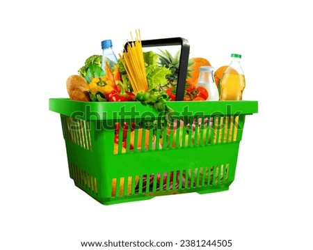 Plastic green shopping basket full of assorted grocery products isolated on white background
