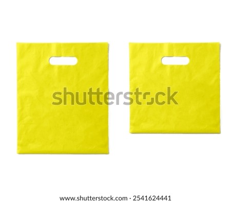 Plastic grocery bag. Close up of empty yellow plastic bag with space for your logo. Isolated on white background. Disposable plastic bag with handles.