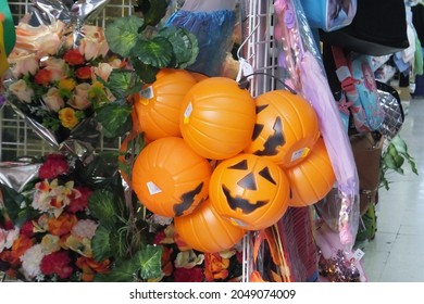 Plastic Halloween pumpkin-shaped baskets for sale at bazaar