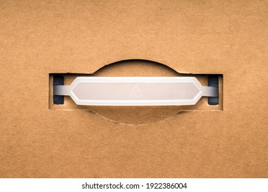 Plastic Handle By Cardboard Box, Flat Lay
