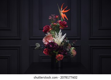 Plastic Handmade Bouquet Artificial Flowers Composition.Beautiful Flowers In Vase On A Table With Black  Background. Women's, Mother's Day. Spring, Summer Season. Front View.Selective Focus.
