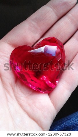 Plastic heart on the handbreadth