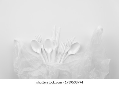 Plastic Items. White Plastic Eating Utensils. For The Presentation Of Waste Recycling. Disposable Tableware