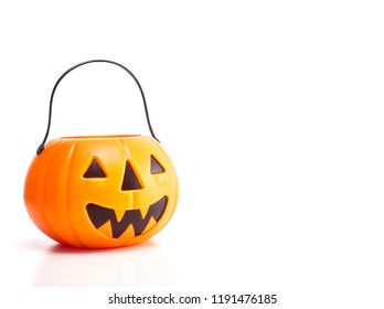 Plastic jack-o-lantern trick or treat on white background With empty space available for Text - Powered by Shutterstock