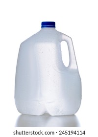 Plastic Jug, Recyclable And Reusable Bottle Jug Container For Water, Milk And Other Liquids With No Tag And Drops On The Surface, Isolated On White Background With Reflection