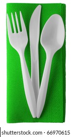 Plastic Knife, Fork And Spoon On Green Paper Napkin - Isolated