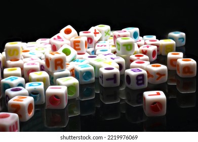 Plastic Letter Beads Macro On Glass