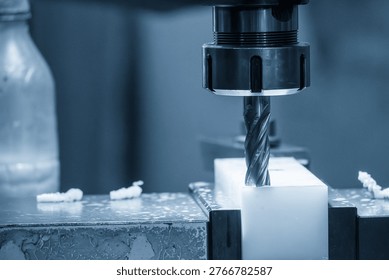 The plastic machining process using an NC milling machine to shape an engineering-grade nylon (polyamide) part.