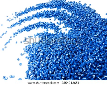 plastic masterbatch, blue masterbatch granules as virgin polymer resin pigment, poured into white background media, suitable for industrial plastic company profile product catalog design