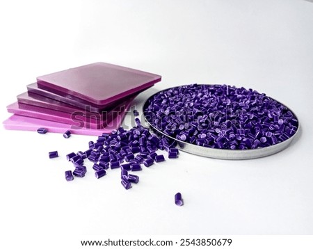 plastic masterbatch, polymer pigment granules resin color cold cutting type raw material plastic pigment in isolated pantry cup with white background for plastic company profile product catalog design