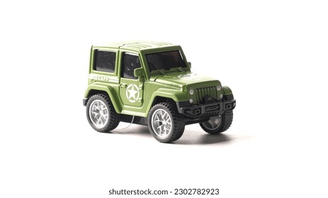 Plastic model of a military SUV toy car isolated on white background. . High quality photo