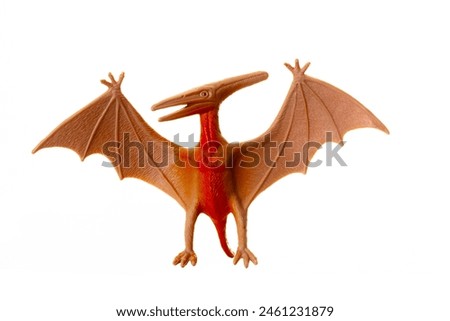 Plastic model of a pterosaur, a flying dinosaur, showcased against a clean white background.