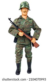 Plastic Model Of A Soldier. Toy Soldier. Isolate On A White Background. Male Doll In Camouflage Clothing.